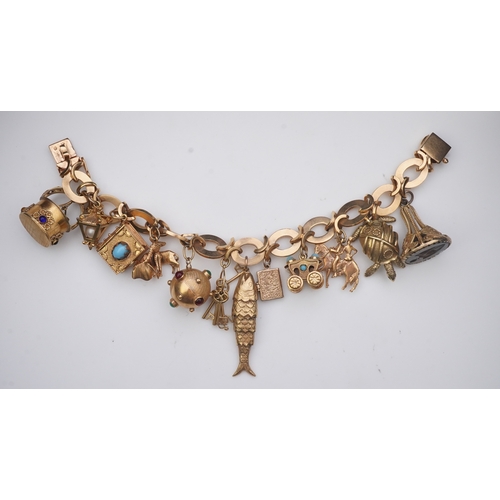 277 - A gold charm bracelet the gold bracelet composed of oval and X-shaped links, suspending a series of ... 