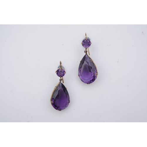 278 - A pair of amethyst earrings, early 20th century, each composed of a circular-cut amethyst suspending... 