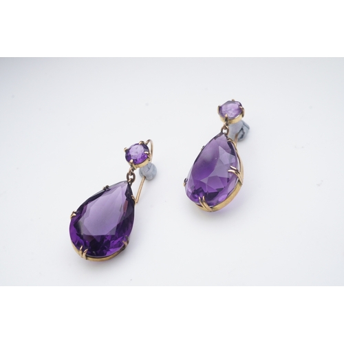 278 - A pair of amethyst earrings, early 20th century, each composed of a circular-cut amethyst suspending... 