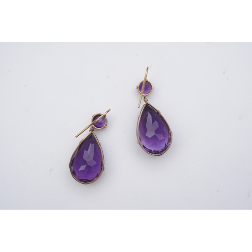 278 - A pair of amethyst earrings, early 20th century, each composed of a circular-cut amethyst suspending... 