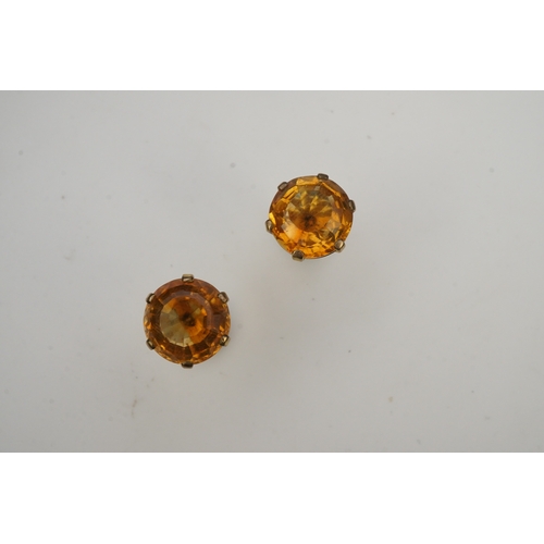 279 - A pair of citrine ear studs, each set with a circular step-cut citrine, 1.3cm diameter each, post fi... 