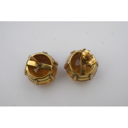 279 - A pair of citrine ear studs, each set with a circular step-cut citrine, 1.3cm diameter each, post fi... 