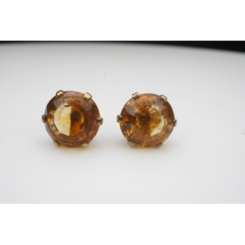 279 - A pair of citrine ear studs, each set with a circular step-cut citrine, 1.3cm diameter each, post fi... 