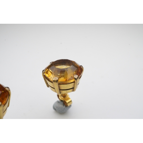 279 - A pair of citrine ear studs, each set with a circular step-cut citrine, 1.3cm diameter each, post fi... 