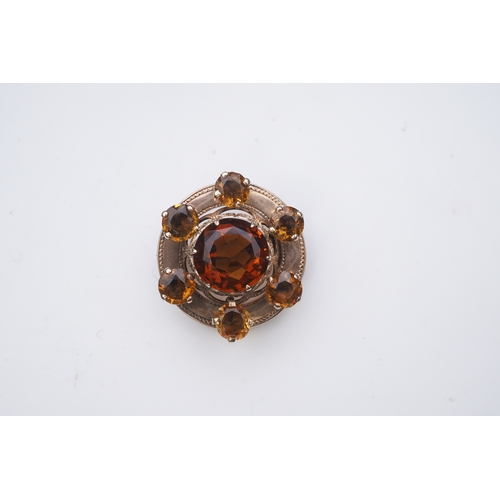 280 - A Victorian citrine brooch, Scotland, late 19th century, of circular outline, set with a concentric ... 