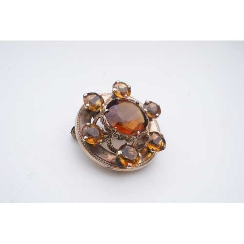 280 - A Victorian citrine brooch, Scotland, late 19th century, of circular outline, set with a concentric ... 