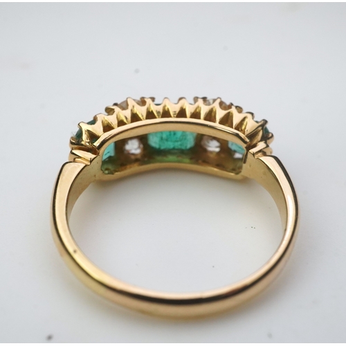 282 - A late Victorian emerald and diamond ring, circa 1901, set with three step-cut emeralds totalling ap... 