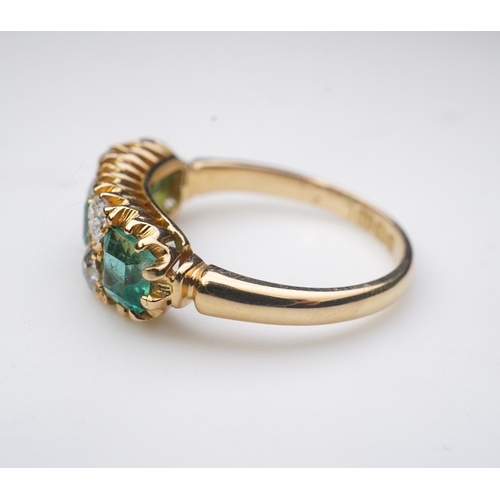 282 - A late Victorian emerald and diamond ring, circa 1901, set with three step-cut emeralds totalling ap... 