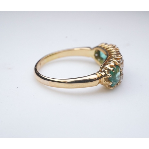 282 - A late Victorian emerald and diamond ring, circa 1901, set with three step-cut emeralds totalling ap... 