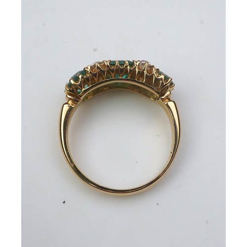 282 - A late Victorian emerald and diamond ring, circa 1901, set with three step-cut emeralds totalling ap... 