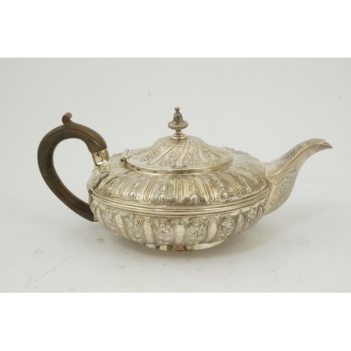 29 - A William IV embossed silver teapot, by Joseph & John Angell, of squat circular form and decorated w... 