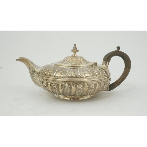 29 - A William IV embossed silver teapot, by Joseph & John Angell, of squat circular form and decorated w... 