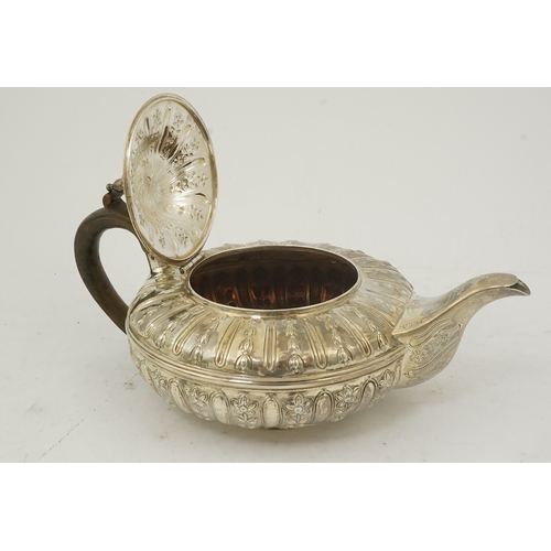 29 - A William IV embossed silver teapot, by Joseph & John Angell, of squat circular form and decorated w... 