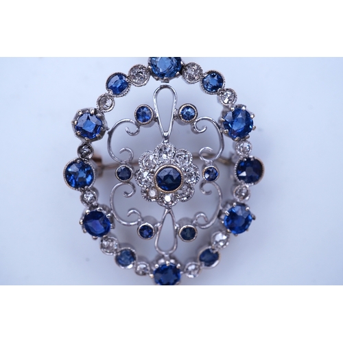 290 - A sapphire and diamond brooch/pendant, mid 20th century, of Edwardian inspiration, composed of a cir... 