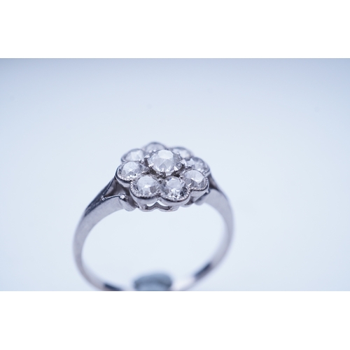 291 - A diamond ring, circa 1920, designed as a floral cluster of circular-cut diamonds totalling approxim... 