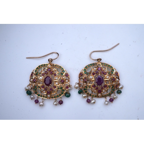 296 - A pair of gem-set and seed pearl earrings, India, each of openwork scroll design, suspending a fring... 