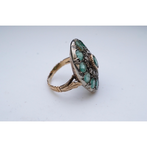 297 - An emerald and diamond ring, of 19th century inspiration, designed as a cluster, centring on a colle... 