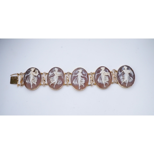 299 - A shell cameo bracelet, Italy, set with five oval shells carved with muses, mounted in 14ct gold, le... 