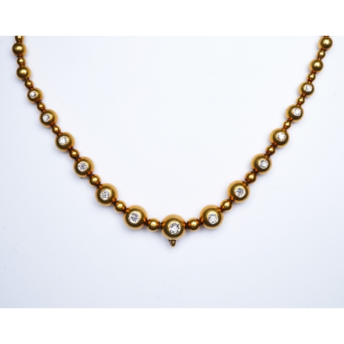 300 - An unusual Victorian gold and diamond necklace, late 19th century, composed of spherical gold beads,... 