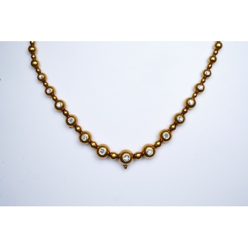 300 - An unusual Victorian gold and diamond necklace, late 19th century, composed of spherical gold beads,... 