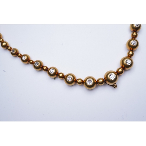 300 - An unusual Victorian gold and diamond necklace, late 19th century, composed of spherical gold beads,... 