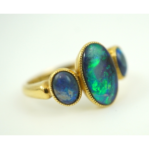 304 - A Victorian black opal ring, circa 1881, set with three cabochon black opals, mounted in 18ct gold, ... 