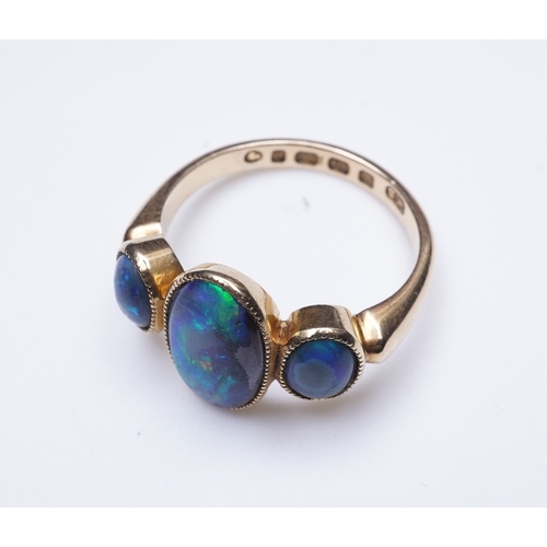 304 - A Victorian black opal ring, circa 1881, set with three cabochon black opals, mounted in 18ct gold, ... 