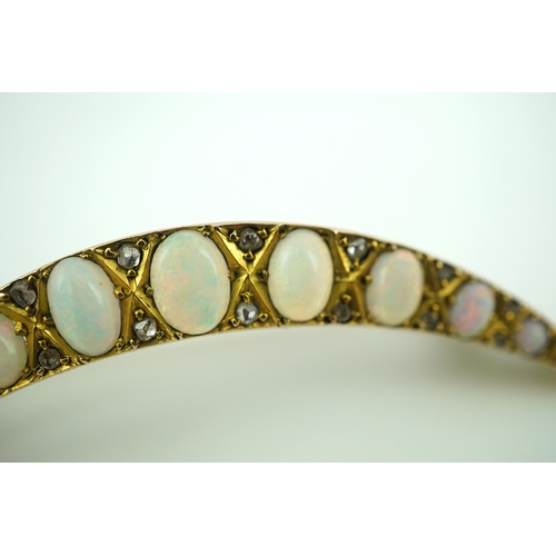 306 - An opal and diamond brooch, early 20th century, designed as a crescent moon, set with opal cabochons... 