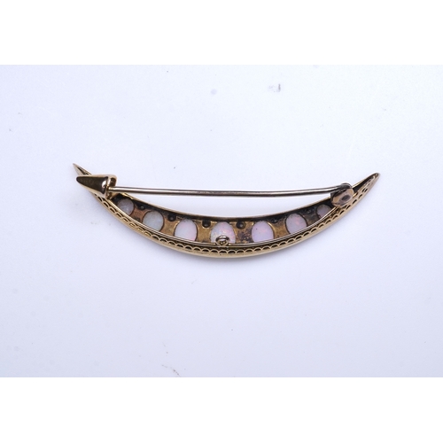 306 - An opal and diamond brooch, early 20th century, designed as a crescent moon, set with opal cabochons... 