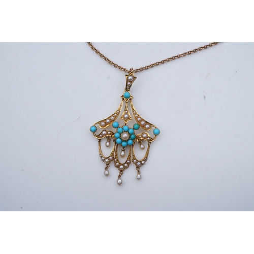 310 - An Edwardian turquoise and seed pearl pendant, early 20th century, of foliate scroll design suspendi... 