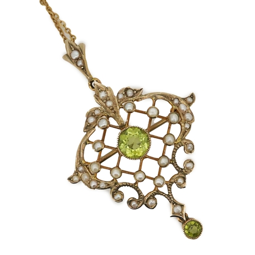 311 - An Edwardian peridot and seed pearl pendant/brooch, early 20th century, of foliate openwork design, ... 