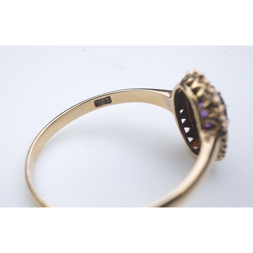 313 - An Edwardian amethyst and seed pearl ring, early 20th century, of cluster design, set with an oval a... 