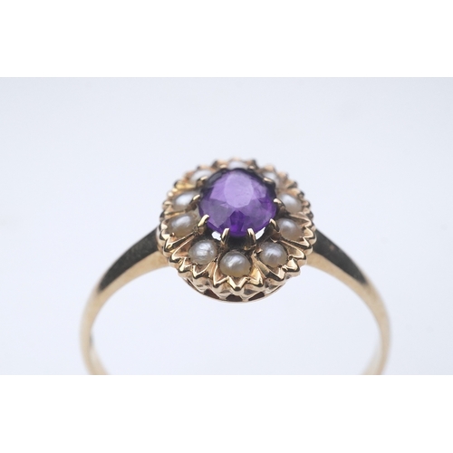 313 - An Edwardian amethyst and seed pearl ring, early 20th century, of cluster design, set with an oval a... 