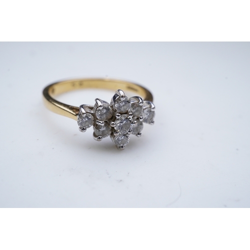 316 - A diamond ring, designed as an elongated cluster of brilliant-cut diamonds, mounted in 18ct gold, si... 