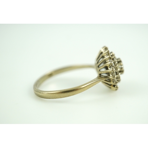 317 - A diamond ring, of cluster design, set with a brilliant-cut diamond within two concentric bands of s... 