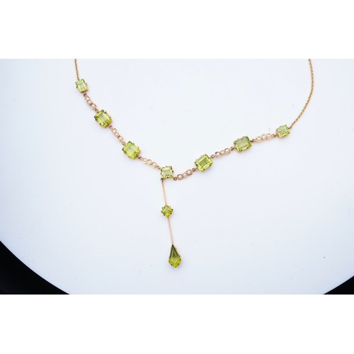 320 - An Edwardian peridot and seed pearl necklace, early 20th century the front composed of links claw-se... 