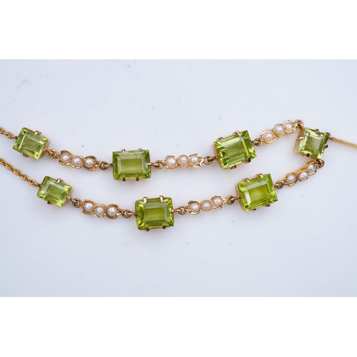 320 - An Edwardian peridot and seed pearl necklace, early 20th century the front composed of links claw-se... 