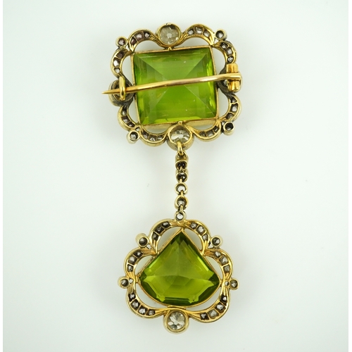 321 - A peridot and diamond brooch, circa 1900 Composed of a step-cut peridot within a foliate border of c... 