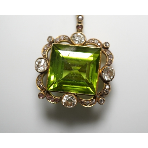 321 - A peridot and diamond brooch, circa 1900 Composed of a step-cut peridot within a foliate border of c... 