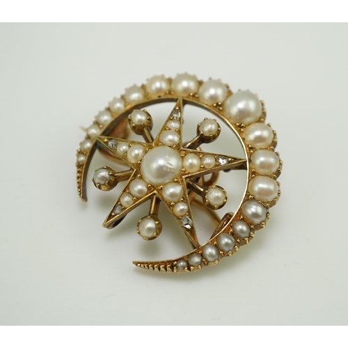 322 - An Edwardian half pearl and diamond brooch, early 20th century, designed as a crescent moon enclosin... 