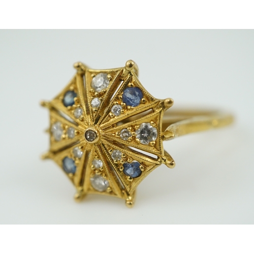 323 - A sapphire and diamond ring, modelled as an open parasol, set with circular-cut sapphires and brilli... 