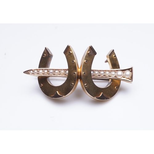 324 - A Victorian gold and seed pearl brooch, mid 19th century designed as a pair of horseshoes joined by ... 