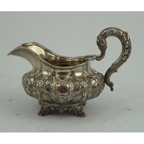 33 - A William IV Irish silver cream jug, by James Le Bas, of squat melon form, with foliate decoration, ... 