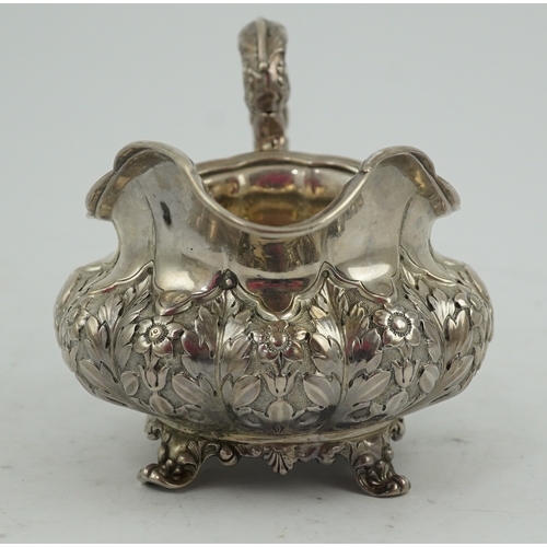 33 - A William IV Irish silver cream jug, by James Le Bas, of squat melon form, with foliate decoration, ... 