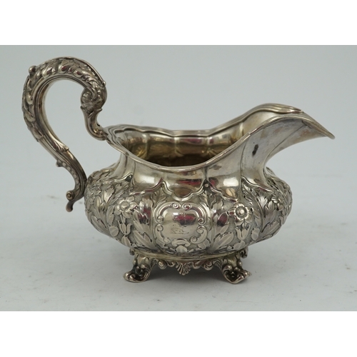 33 - A William IV Irish silver cream jug, by James Le Bas, of squat melon form, with foliate decoration, ... 