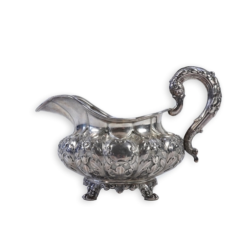 33 - A William IV Irish silver cream jug, by James Le Bas, of squat melon form, with foliate decoration, ... 