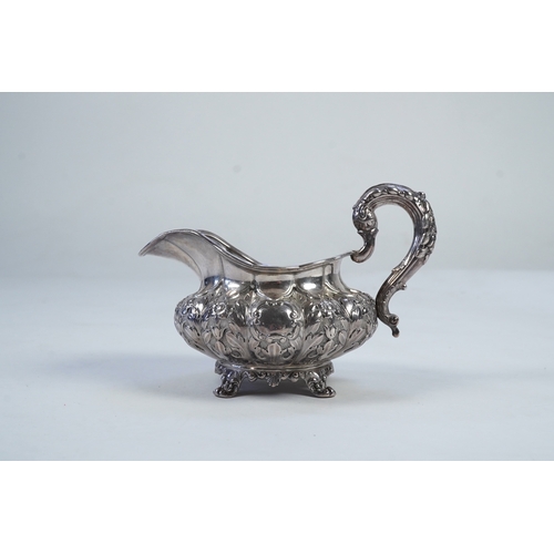 33 - A William IV Irish silver cream jug, by James Le Bas, of squat melon form, with foliate decoration, ... 