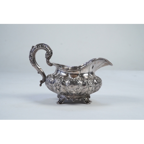 33 - A William IV Irish silver cream jug, by James Le Bas, of squat melon form, with foliate decoration, ... 