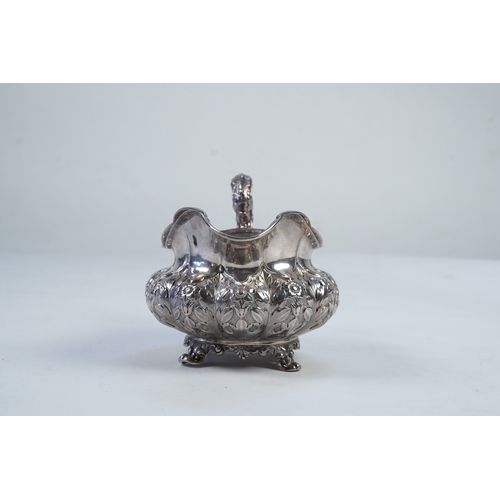 33 - A William IV Irish silver cream jug, by James Le Bas, of squat melon form, with foliate decoration, ... 