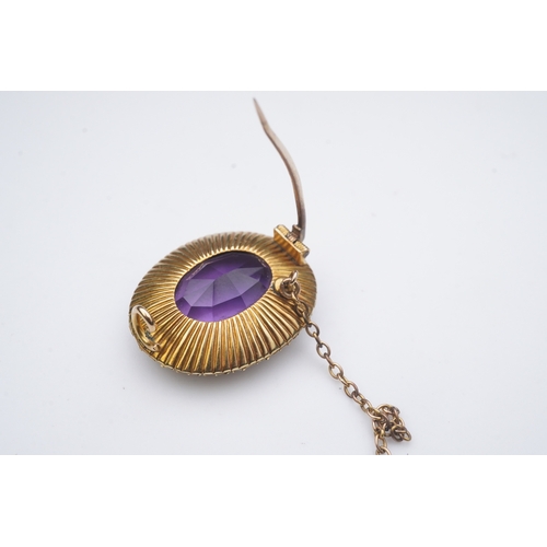 330 - An amethyst and split pearl brooch, circa 1900, of oval outline, set with an oval amethyst within a ... 